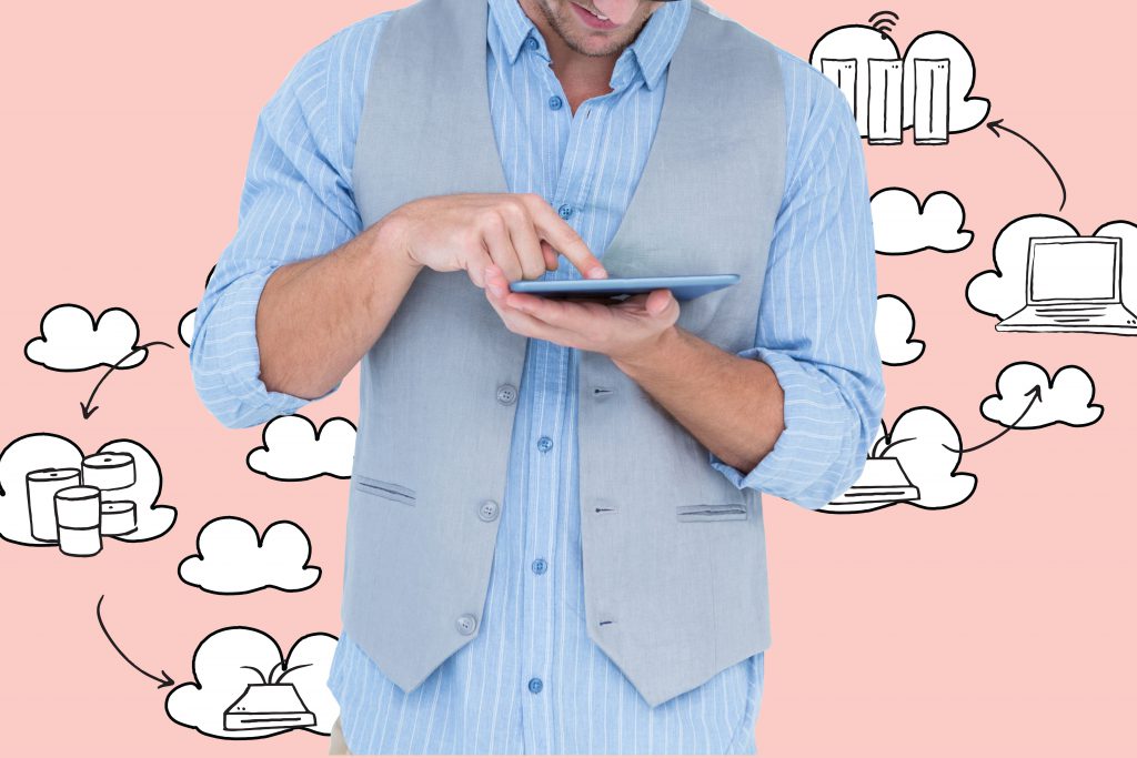 Composite image of man holding and using digital tablet with icons background